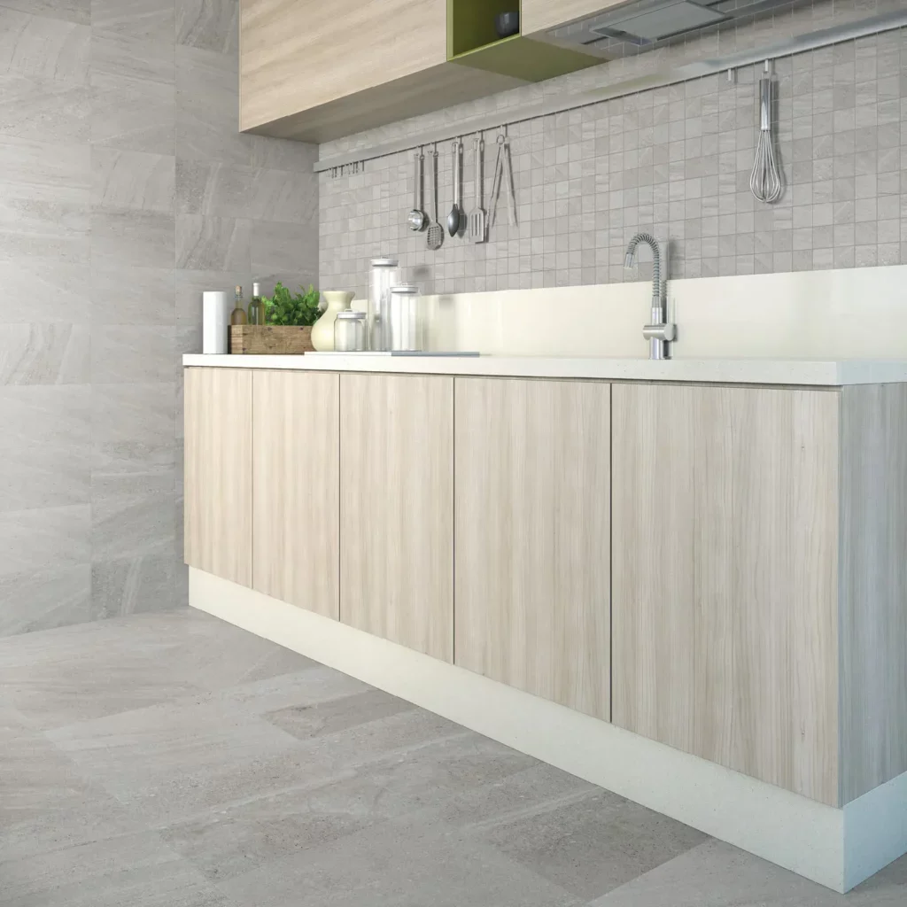 Gray tile on floors and walls in a modern kitchen